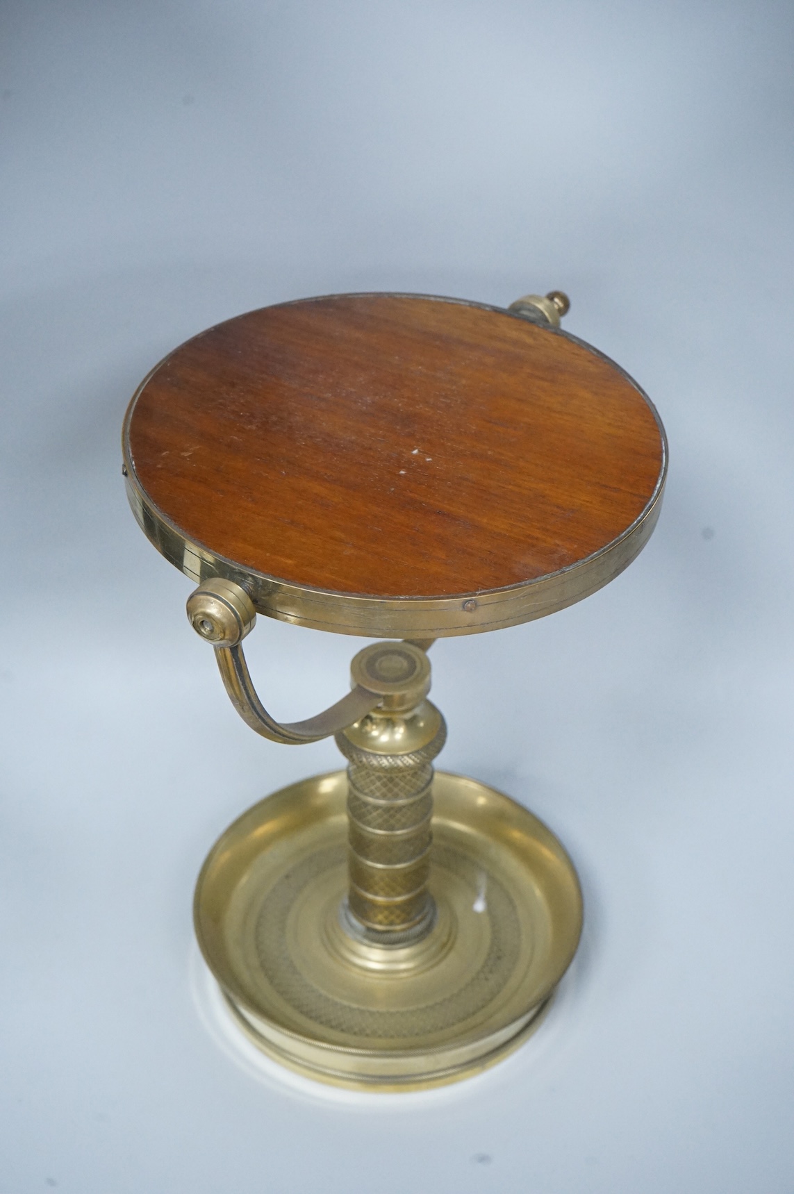 Engine turned brass shaving mirror, 35cm high
